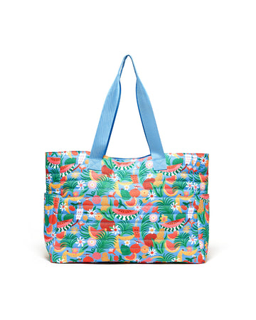 large tote bag with abstract fruit print, blue ground and side pockets