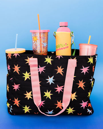 go go work bag with black ground, colorful starburst print and two sides pink/yellow straps filled with cups