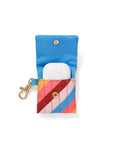 inside of earbuds case with diagonal rainbow stripes and gold clasp