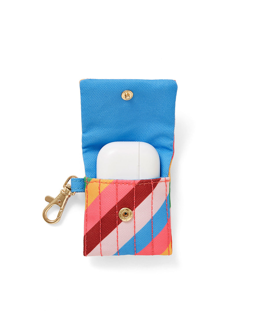 inside of earbuds case with diagonal rainbow stripes and gold clasp