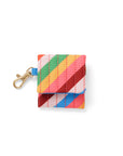 earbuds case with diagonal rainbow stripes and gold clasp