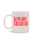 ceramic mug with white ground and link and red 'living legend' across the front