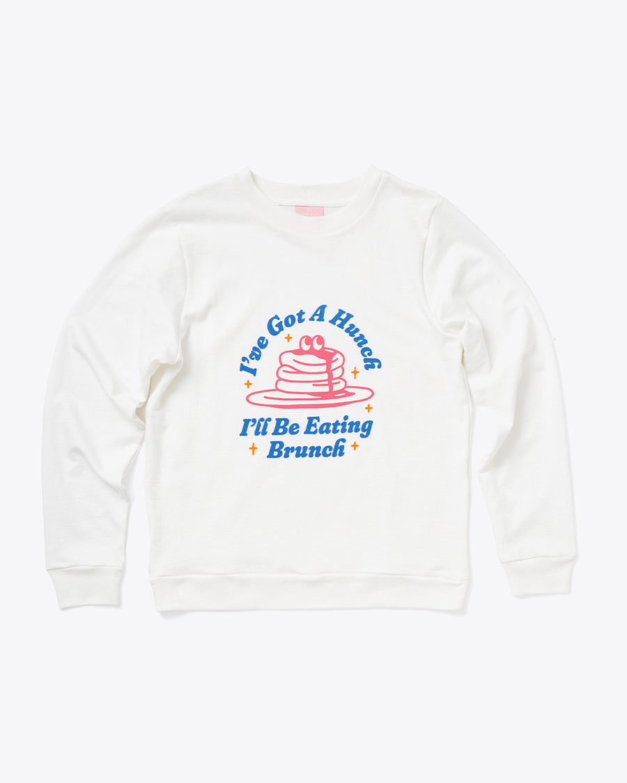 white sweatshirt with pancake graphic and 'I'VE GOT A HUNCH, I'LL BE EATING LUNCH'