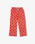long pajama pants in red and pink basket weave plaid pattern with blue tie waist and ricrac trim on ankles