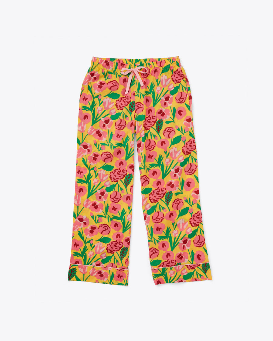 long pajama pants in yellow with pink and green floral pattern and pink tie waist and ricrac ankle detail