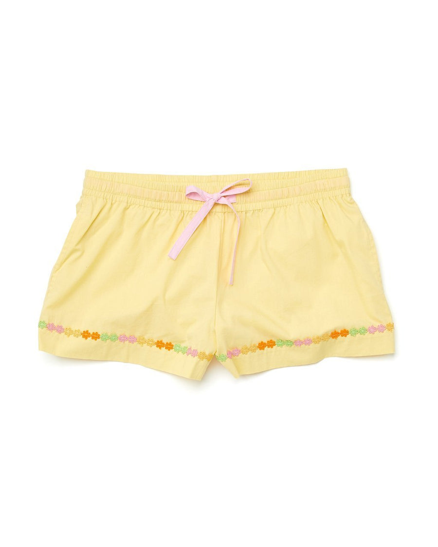 light yellow leisure shorts with a pink draw ribbon and a daisy applique trim at the bottom 