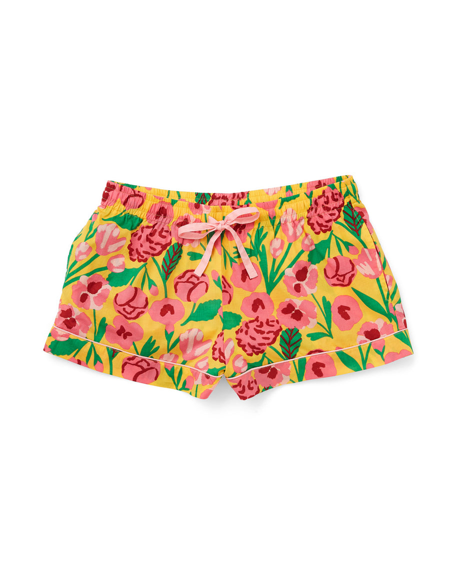 pajama shorts in yellow with pink and green floral pattern and pink tie waistl