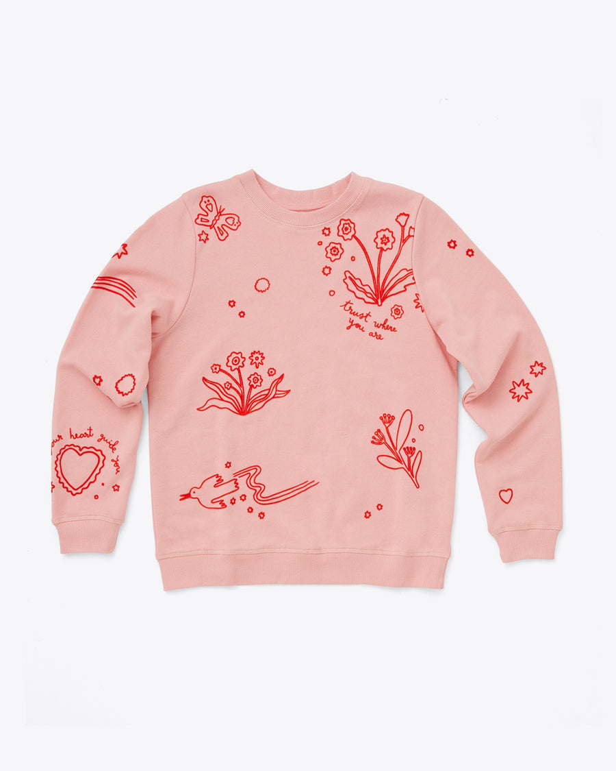 light pink sweatshirt with a floral design and quotes