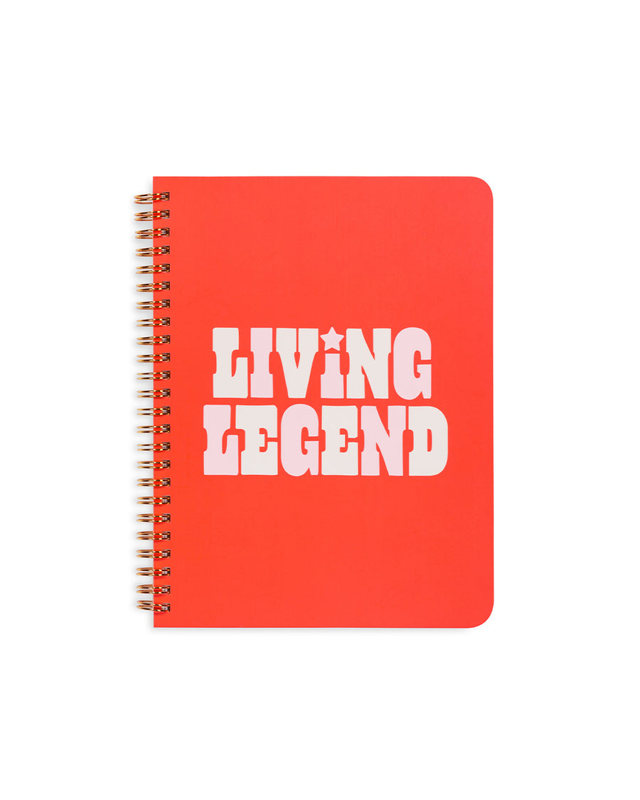 mini rough draft notebook with red cover and light pink and white 'living legend'  across the front