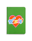 green passport holder with colorful 'howdy' across the front