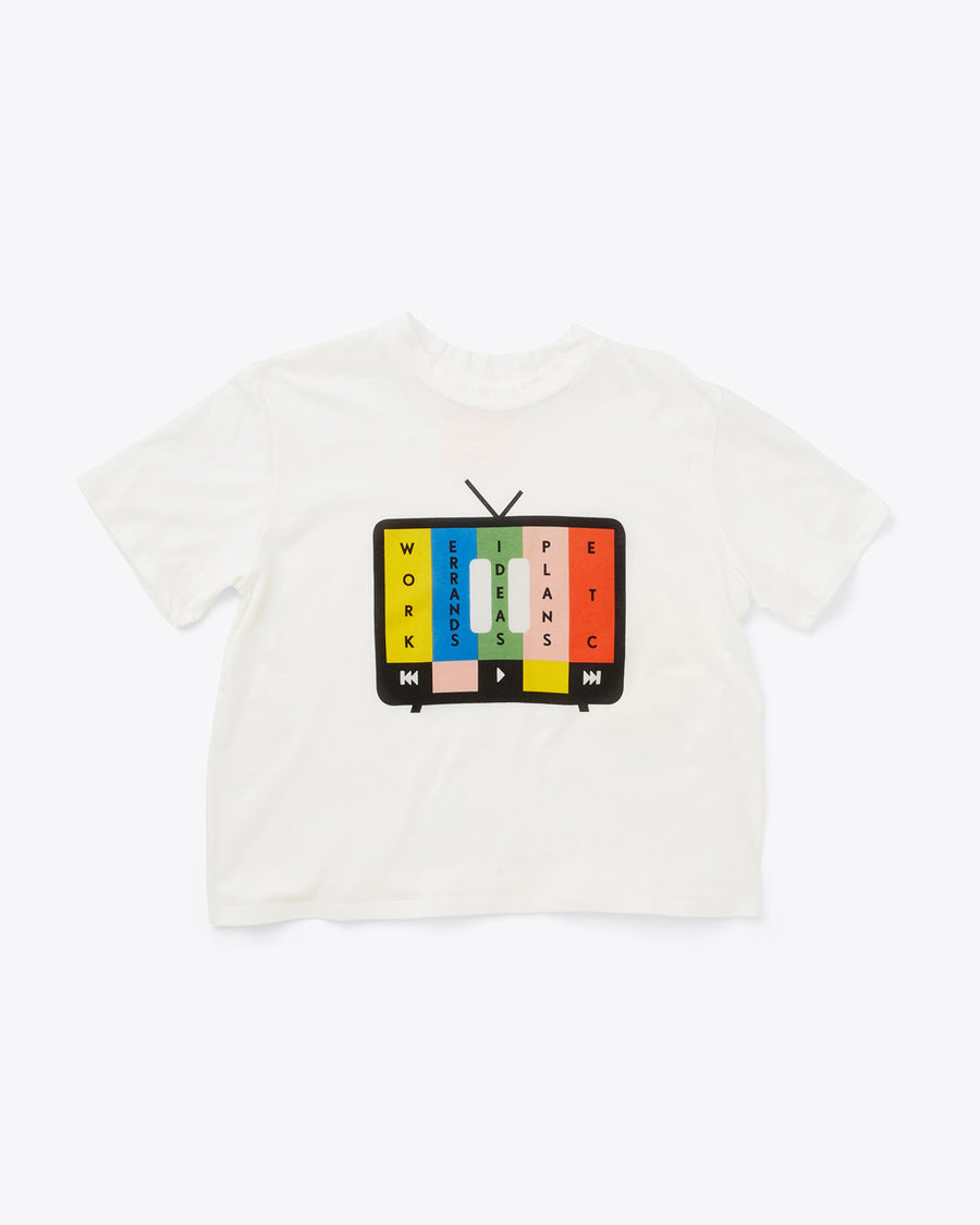 ivory cropped tee with vintage TV graphic with "PAUSE" symbol over multicolor bars