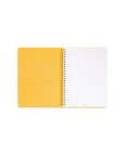 inside yellow pocket and white lined paper in mini notebook