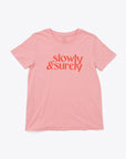 pink t-shirt with red "slowly & surely" text graphic