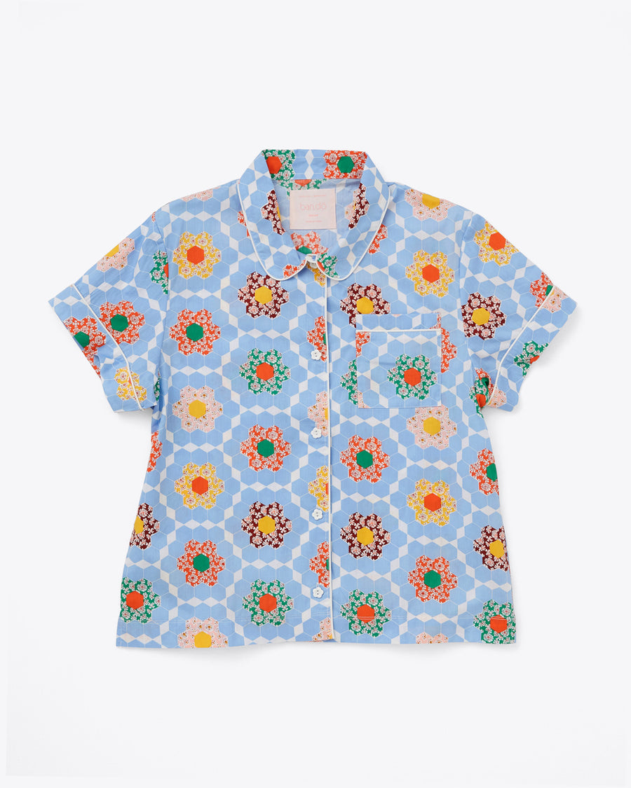 short sleeve pajama shirt in blue patchwork quilt pattern with white piping detail