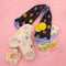 editorial image of starburst neck wrap, slippers, and spa set