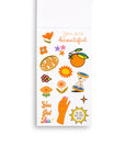 interior page of sticker book showing orange stickers