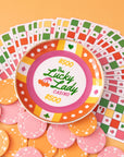 poker chip trinket tray with colorful print with 'the lucky lady casino $500' across the front surrounded by poker chips and playing cards