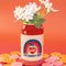 backview of lucky cherry cream soda can vase with flowers