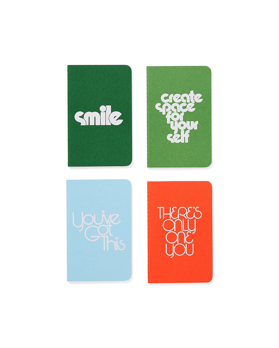 notebooks that say: 'smile', 'create space for yourself', 'you've got this', 'there's only one you'