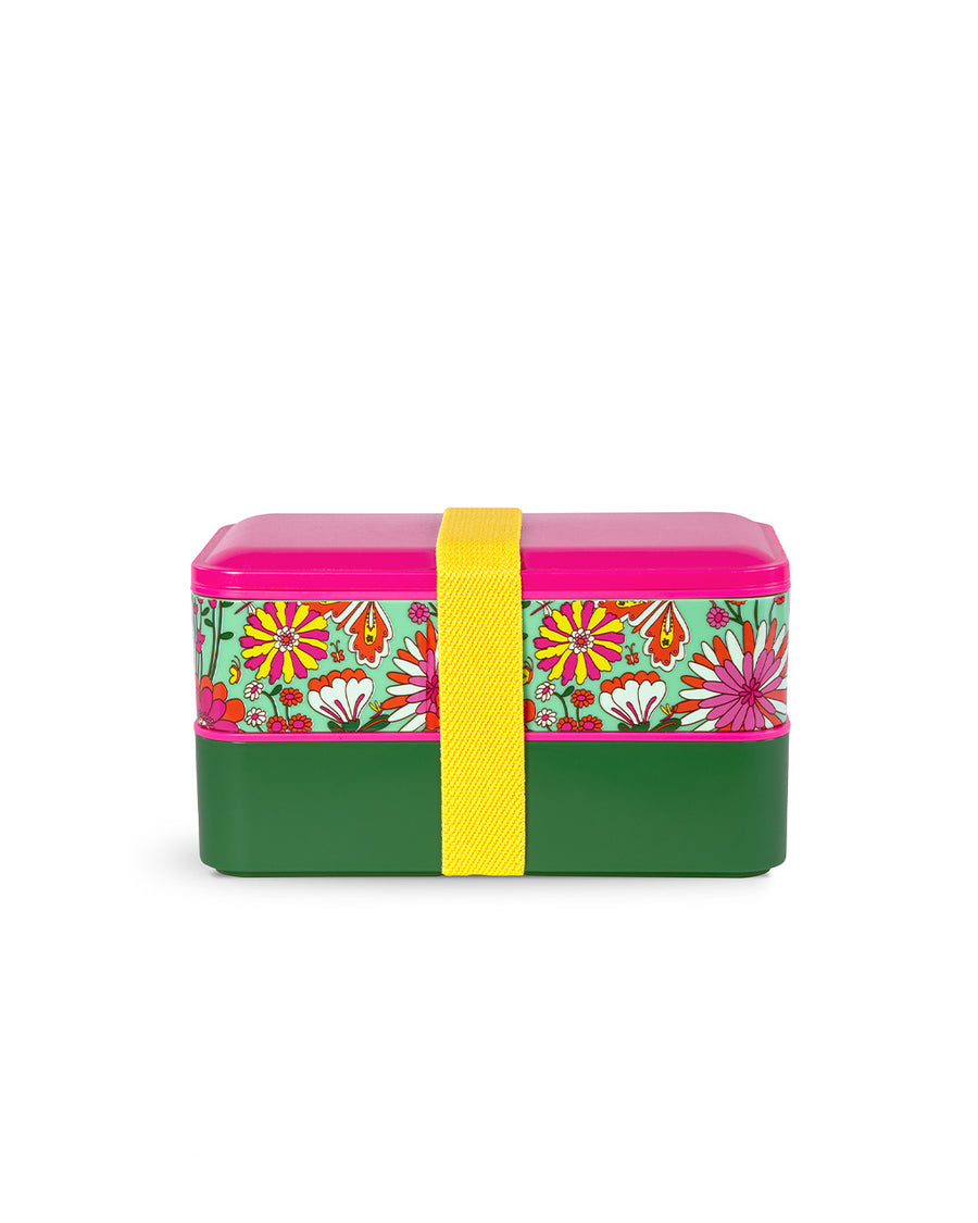 two plastic stacking bento boxes with hot pink lid, mint floral print, and dark green solid. both wrapped with yellow elastic