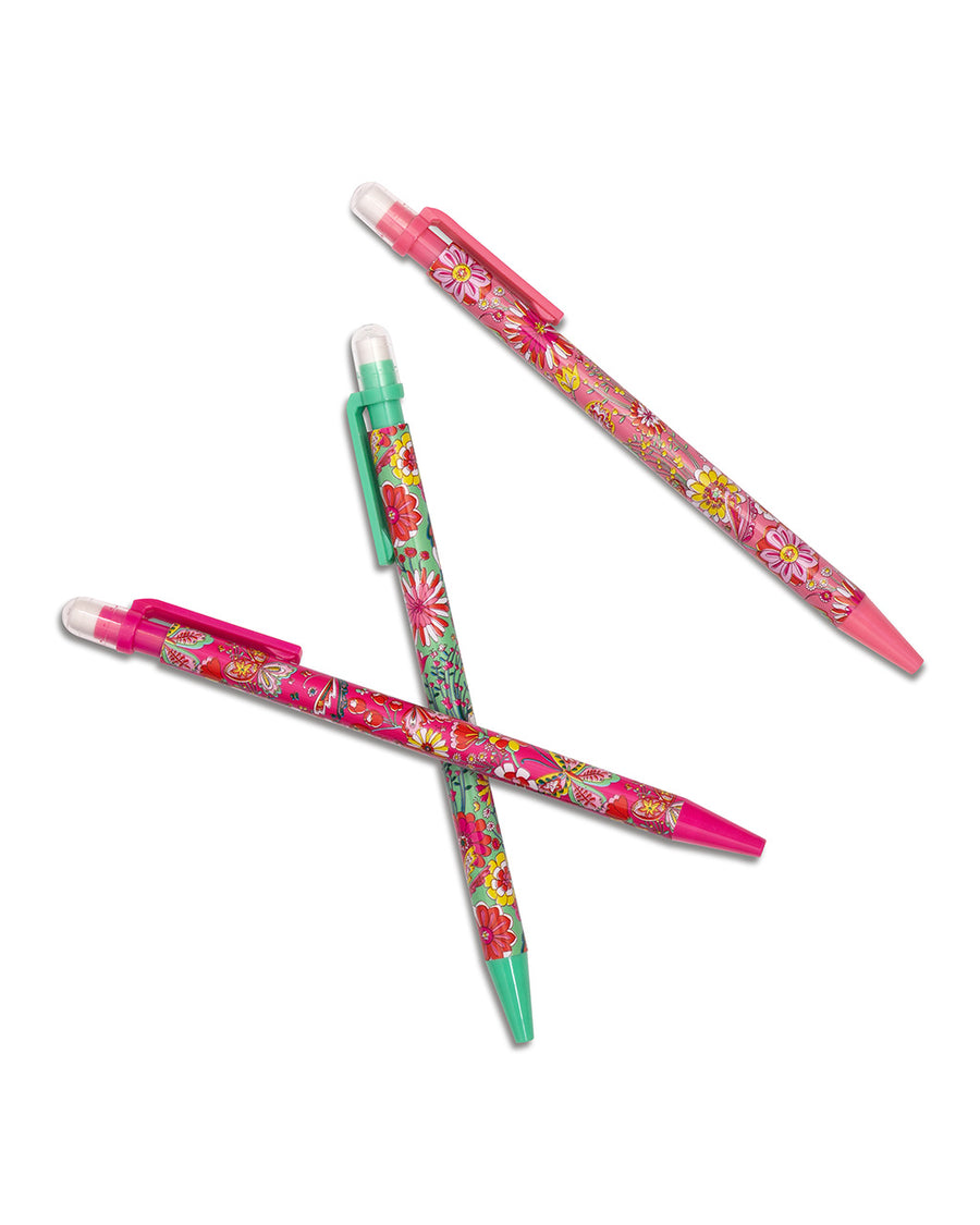 set of three mechanical pencils with three floral prints scattered on the table