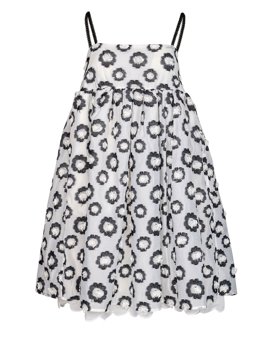 still image of  light blue mini dress with black straps and all over textured black and white flowers